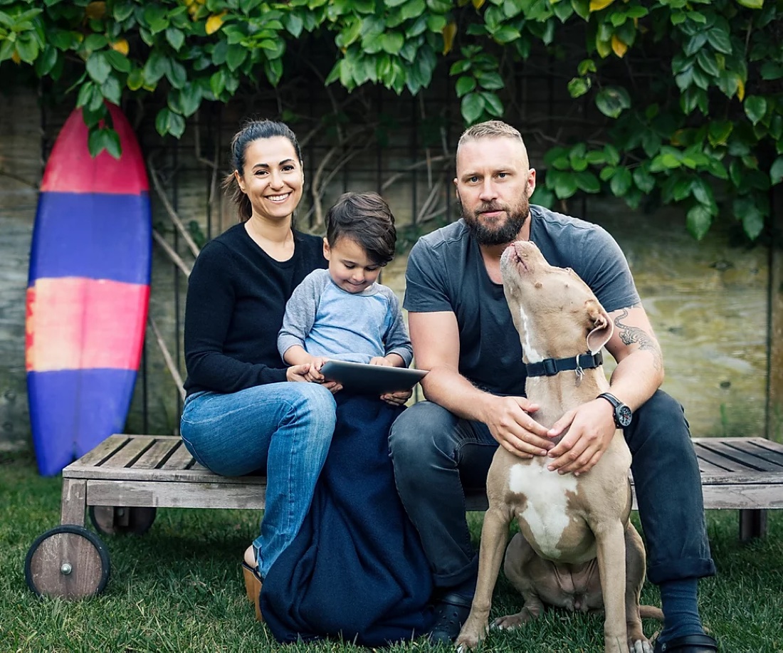 A family spending time with their dog